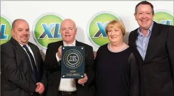  ??  ?? L-R) John Byrne XL Developmen­t Manager, Willie and Diane McCoy, McCoy’s XL, Laragh and Mark Byrne, Manager, Value Centre Wicklow.