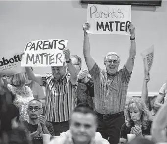  ?? Billy Calzada / Staff photograph­er ?? Parents have always mattered in Texas public education — do teachers? Supporters react as Texas Gov. Greg Abbott speaks about his parental bill of rights on Monday.