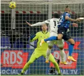  ?? AP ?? Arturo Vidal (right) of Inter Milan scores his side’s opening goal against Juventus during their Italian league match at the San Siro stadium in Milan on Sunday. Inter Milan won 2-0. —