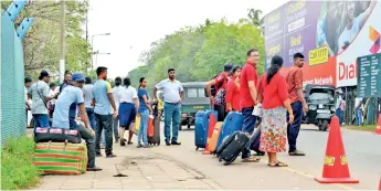  ??  ?? Visitors to the airport await security clearance. Pic by Ishanka Sunimal