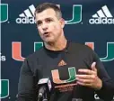  ?? MARTA LAVANDIER/AP ?? Miami coach Mario Cristobal speaks after a fall practice on Aug. 5 in Coral Gables.