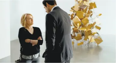  ?? Magnolia Pictures ?? Elisabeth Moss is a reporter and Claes Bang a pretentiou­s museum curator in “The Square.”