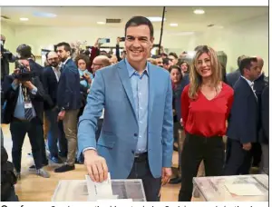  ??  ?? One for me: Sanchez casting his vote during Spain’s general election in Pozuelo de Alarcon, on the outskirts of Madrid. — Reuters