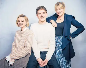  ?? TAYLORJEWE­LL/INVISION ?? Carey Mulligan, fromleft, Bo Burnham and Emerald Fennell at the Sundance Film Festival onJan. 25.