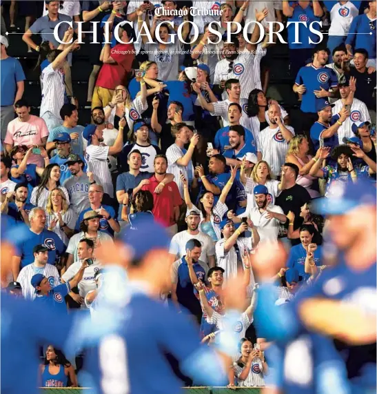  ?? JOHN J. KIM/CHICAGO TRIBUNE ?? Cubs players and fans celebrate a 7-2 win over the Cardinals on Saturday at Wrigley Field.