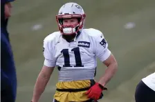  ??  ?? NANCY LANE / BOSTON HERALD IT’S HIS TIME: Julian Edelman warms up before practice yesterday as the Patriots prepare to host the Chargers in Sunday’s AFC Division Round game.