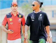  ?? | Reuters ?? A MOVE to Ferrari by Lewis Hamilton (right), seen here with Carlos Sainz, would be a surprise one, as he has signed a two-year contract with Mercedes for the 2024 and 2025 seasons.