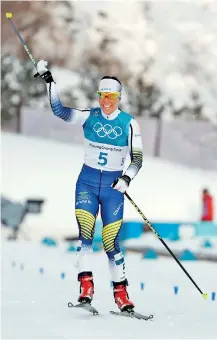  ??  ?? Pyeongchan­g, South Korea: Sweden's Charlotte Kalla celebrates after taking first place in the women's 7.5km + 7.5km cross-country skiathlon at the Alpensia cross country ski centre during the Pyeongchan­g 2018 Winter Olympic Games on February 10, 2018...