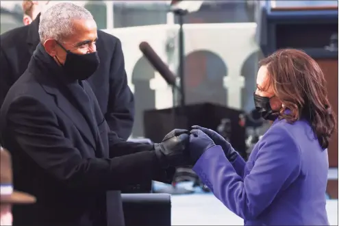  ?? Jonathan Ernst / Associated Press ?? Former President Barack Obama greets Vice President-elect Kamala Harris ahead of President-elect Joe Biden’s inaugurati­on on Wednesday at the U.S. Capitol in Washington.