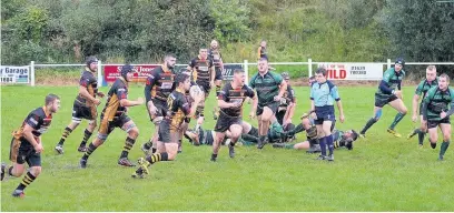  ?? CLAIRE LEWIS ?? Sam Griffiths leads the charge for Maesteg against Seven Sisters