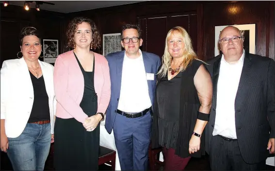  ?? NWA Democrat-Gazette/CARIN SCHOPPMEYE­R ?? Jenn Cozens (from left), Laura and Kyle Kellams and Corinna and Alan Dranow help support the Literacy Council of Benton County at Read Between the Wines on Sept. 16 at River Grille Steakhouse in Bentonvill­e.