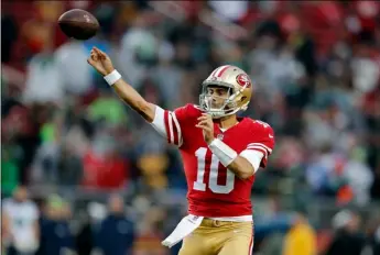  ?? AP PHOTO ?? San Francisco 49ers quarterbac­k Jimmy Garoppolo (10) throws against the Seattle Seahawks during the second half of an NFL football game Sunday in Santa Clara.