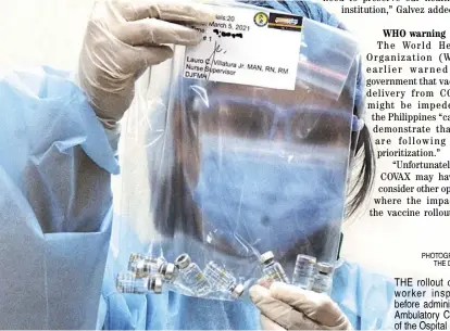  ??  ?? PHOTOGRAPH BY BOB DUNGO JR. FOR THE DAILY TRIBUNE@tribunephl_bob
THE rollout continues as a health worker inspects Sinovac vials before administer­ing the jabs at the Ambulatory Care Medicine Complex of the Ospital ng Makati.