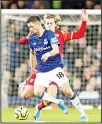  ??  ?? Norwich City’s Todd Cantwell (right), and Everton’s Morgan Schneiderl­in battle for the ball during the English Premier League soccer match between Norwich City and Everton at Goodison Park, Liverpool, England on Nov 23. (AP)