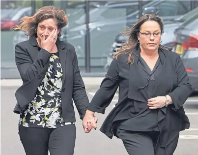  ??  ?? SUPPORT: Sherry Fitzpatric­k with her sister DeeAnn Fitzpatric­k, right, outside the tribunal in Aberdeen