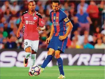  ?? Rex Features ?? Sergio Busquets of Barcelona is eyed by Deyverson Silva of Alaves in the La Liga match in September. The returning Busquets is likely to be involved in the meeting between the two today.