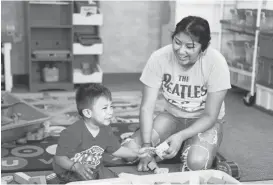  ?? JOSIE LEPE/STAFF ?? Isabel Lopez, plays with her son, Elias, at the Mayfair Community Center in San Jose. “I want to teach him how to find his own opportunit­ies in life, just like I’m doing now,” she says.