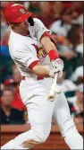  ?? AP/JEFF ROBERSON ?? Paul Goldschmid­t of the St. Louis Cardinals hits a go-ahead three-run home run during the eighth inning Friday in a 5-3 victory against the Houston Astros in St. Louis. It was his career-high fifth consecutiv­e game with a home run.