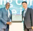  ??  ?? DR SIYABONGA Cwele and Li Peng, Huawei South Africa’s president.