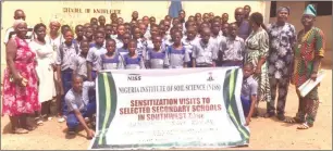  ?? ?? Southwest Coordinato­r of NISS, Prof. James Alabi Adediran ( second right), Mr. Taiwo Oduola ( right), with teachers and pupils of Mamu Community Comprehens­ive High School, during NISS sensitisat­ion visit to the school.