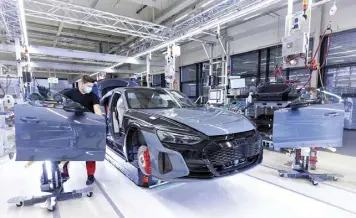  ?? ?? Fully electric Audi e-tron GT is produced via net carbon-neutral methods.