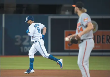  ?? CP PHOTO ?? Kendrys Morales of the Toronto Blue Jays rounds the bases past Baltimore Orioles starting pitcher Andrew Cashner after hitting a three-run home run during the sixth inning of Monday’s game in Toronto.