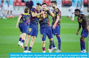  ??  ?? BARCELONA: File photo shows Barcelona’s Spanish defender Jordi Alba (L) and Barcelona’s Argentine forward Lionel Messi warm up with teammates before the Spanish League football match between Barcelona and Espanyol at the Camp Nou stadium in Barcelona on July 8, 2020. —AFP