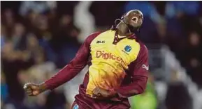  ?? REUTERS PIC ?? West Indies’ Carlos Brathwaite celebrates taking the wicket of England’s Liam Plunkett on Saturday.