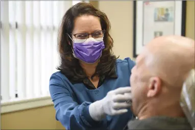  ?? LAUREN A. LITTLE — MEDIANEWS GROUP ?? Dr. Tammy Balatgek of the Center for TMJ and Sleep Disorders, Reading, works with a patient.