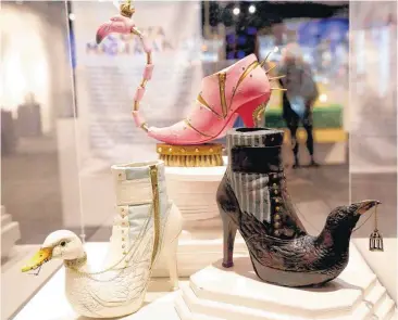  ?? [PHOTOS BY SARAH PHIPPS, THE OKLAHOMAN] ?? Shoes designed by Israeli artist Costa Magarakis are displayed in an upcoming exhibit “Sole Expression: The Art of the Shoe” at Science Museum Oklahoma in Oklahoma City.