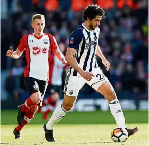  ?? — AFP ?? Moving fast: West Bromwich Albion defender Ahmed Hegazy (right) in action during the English FA Cup fifth-round match against Southampto­n at the Hawthorns on Saturday.