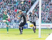  ??  ?? Jason Cummings scores Hibs’ winning goal.