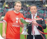  ??  ?? Derek McInnes with his captain, Russell Anderson, after Aberdeen’s 2014 League Cup Final success