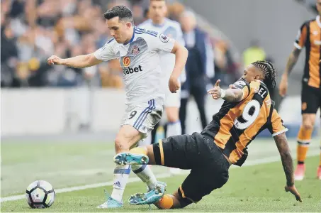  ??  ?? Sunderland midfielder George Honeyman gets away from Hull striker Abel Hernandez in last weekend’s 2-0 away victory.