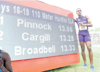  ??  ?? LEFT: Wayne Pinnock of Kingston College celebrates his record breaking win in the Class One boys 110m hurdles final at last year’s ISSA/GraceKenne­dy Boys and Girls’ Championsh­ips.