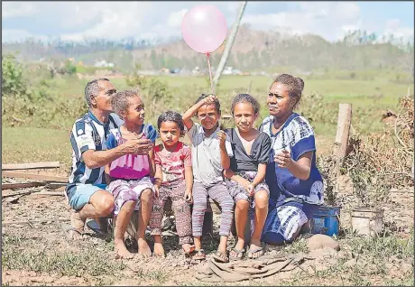  ?? Picture: JOVESA NAISUA ?? Mirzah Mohammed Kalim and his family, from left, Heena Talei, Eliza Rosi, Siana Samantha, Torika Holena and his wife Varanisese Rokovala at the spot where their house used to sit in Vuniuto, Bua.