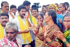 ?? — DC ?? TD working president A. Revanth Reddy interacts with Mid Manair floodaffec­ted people in Manwada of Karimnagar district on Tuesday.