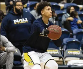  ?? PHOTOS BY AP ?? Northern Arizona’s Omar Ndiaye does not have a right hand because of a birth defect, but he was still talented enough to become a Division I basketball player.