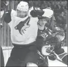  ?? The Canadian Press ?? Arizona Coyotes left-winger Lawson Crouse collides with Canucks defenceman Troy Stecher in Vancouver, Thursday.