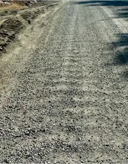  ?? ?? The obvious 'washboardi­ng' on the gravel road through the river bottom near Upper Globe Bridge. It will be nice to get this smoothed out when the Cold Mix asphalt is put down.