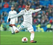  ?? FRANCISCO SECO / AP ?? Real Madrid’s Gareth Bale shoots during Tuesday’s Spanish Copa del Rey last-32, second-leg match against Fuenlabrad­a at Santiago Bernabeu Stadium in Madrid. Madrid advanced 4-2 on aggregate.