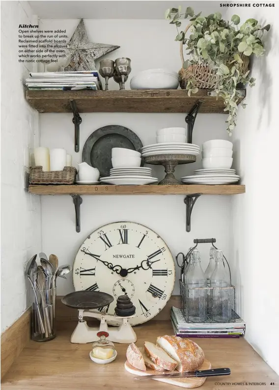  ??  ?? Kitchen
Open shelves were added to break up the run of units. Reclaimed scaffold boards were fitted into the alcoves on either side of the oven, which works perfectly with the rustic cottage feel