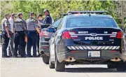  ?? [PHOTO BY CHRIS LANDSBERGE­R, THE OKLAHOMAN] ?? Oklahoma City police gather at the scene where a woman and her dog were mauled to death by two large dogs on Thursday.