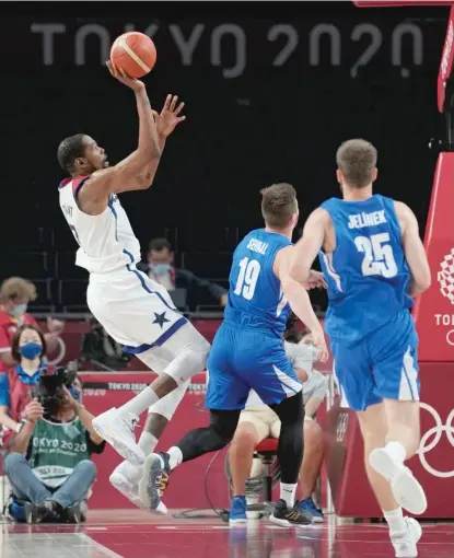  ?? ERIC GAY/AP ?? Kevin Durant (left) passed Carmelo Anthony as the all-time leader in points and field goals for the U.S. Olympic team.