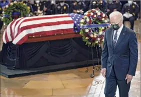  ?? J. Scott Applewhite / AP ?? President Joe Biden is seen at a ceremony to honor U.S. Capitol Police officer William "Billy" Evans as he lies in honor Tuesday at the Capitol.