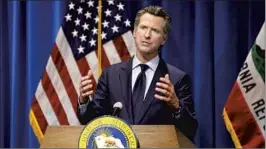  ?? Rich Pedroncell­i Associated Press ?? GOV. GAVIN NEWSOM talks to reporters about his budget proposal last year.