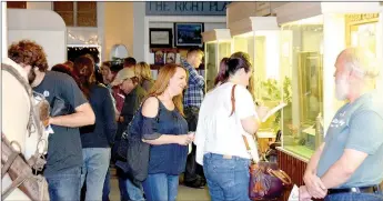  ?? Michael Burchfiel/Herald-Leader ?? When they weren’t visiting the bars of Siloam Springs, participan­ts in Oktoberfes­t: Tap into History toured the Siloam Springs Museum, where several artifacts relating to Simon Sager were on display to highlight Siloam Springs’ German roots.