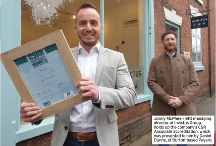  ??  ?? Jonny McPhee, (left) managing director of Invictus Group, holds up the company’s CSR Associate accreditat­ion, which was presented to him by Daniel Dunne, of Burton-based Payaro.