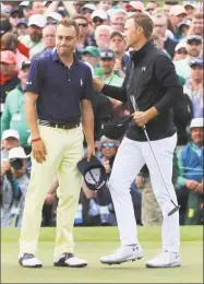  ?? Curtis Compton / Tribune News Service ?? Jordan Spieth, right, and Justin Thomas on the 18th after Spieth bogeyed to fall to 13-under par on Sunday at the Masters in Augusta, Ga.