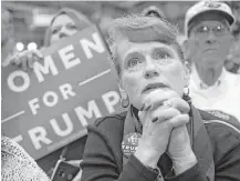  ?? Justin Merriman / Getty Images ?? A supporter of Republican presidenti­al candidate Donald Trump focuses on his message Friday during a campaign stop at the Cambria County War Memorial Arena in Johnstown, Pa.